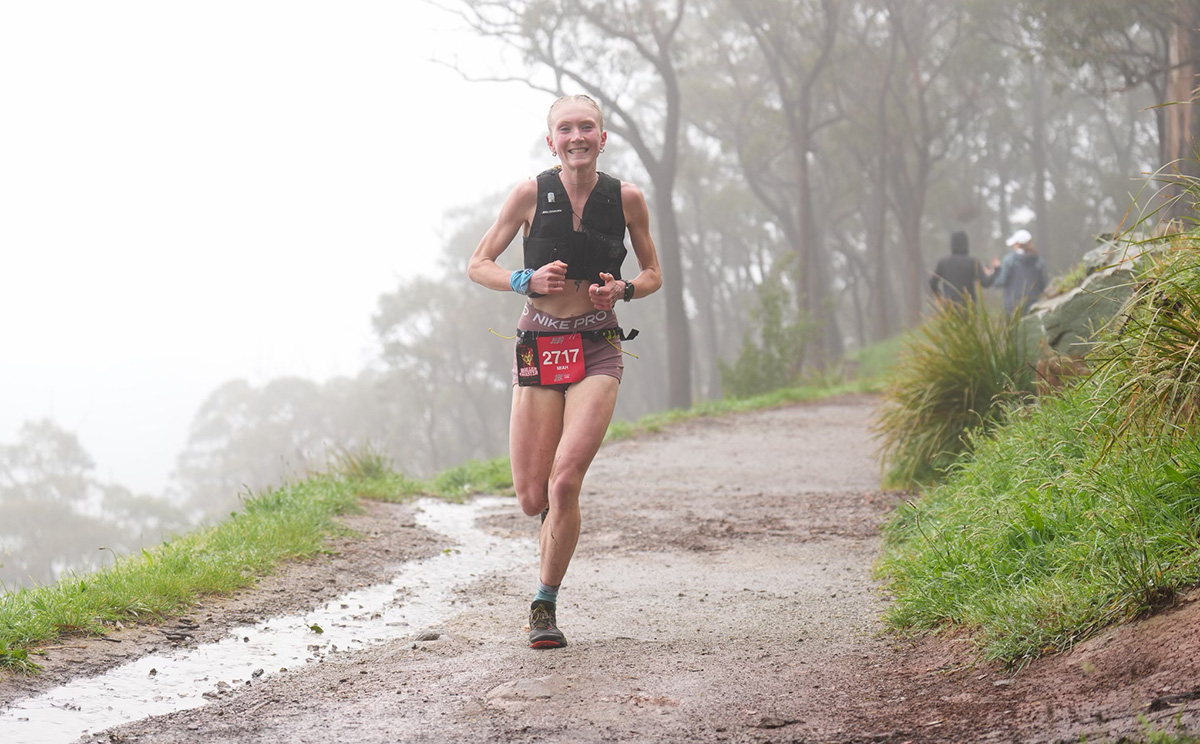 Runner performing in-person strength coaching session